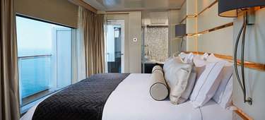 NCL Bliss Haven-Deluxe-Owners-Suite-Bedroom.jpg